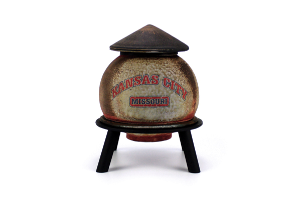 3 KC, MO Water Tank, 12 in. (30 cm) in height, stoneware, Toshiko Black glaze on lid, wood/soda fired to cone 11, decals fired to cone 017, fabricated steel base. 