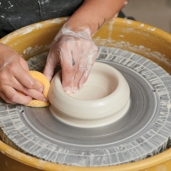 1 Open a centered mound of clay and compress the middle.