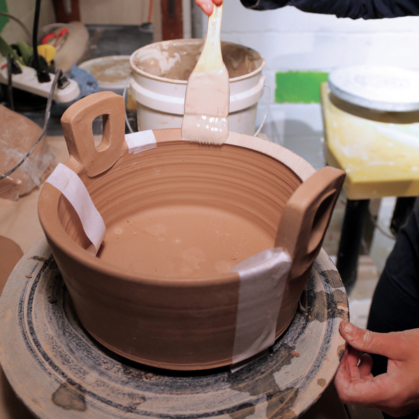 11 Mask off the areas using strips of paper soaked in water.