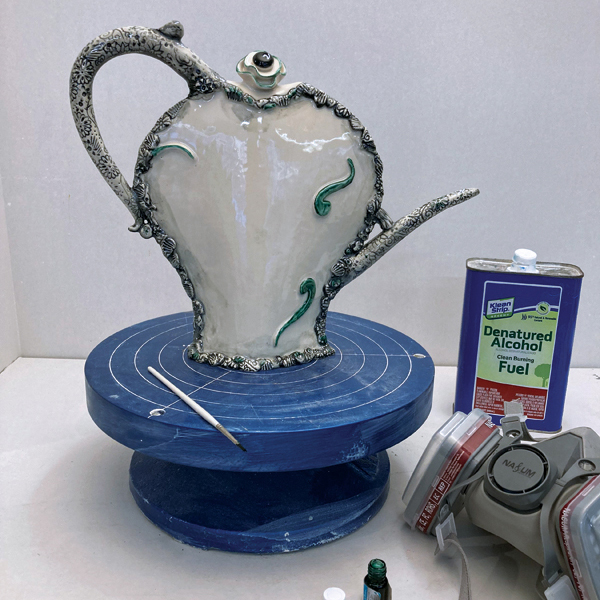 11 Apply clear glaze, then fire. Add silver luster as highlights and fire again. 