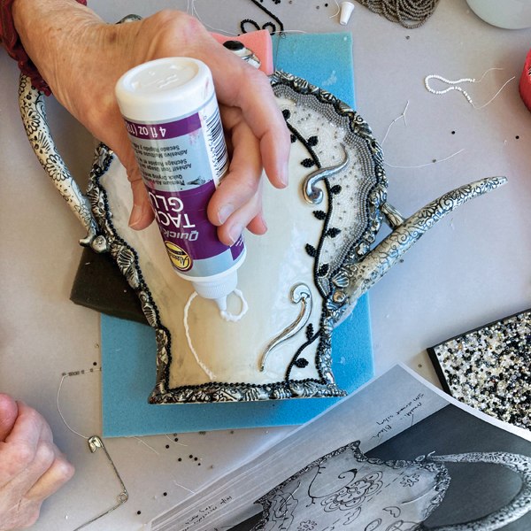 12 Plan your beaded design, then apply lines of tacky glue in small areas at a time.