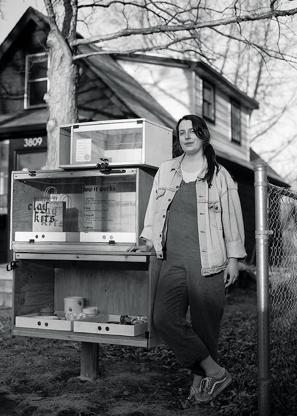 3 Cameron stands in front of a new clay-kit drop box made and installed by designer/architects Koto and Austin Watanabe. Photo: Easton Green. 