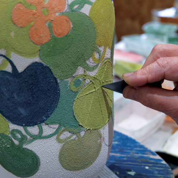 12 Scratch lines into the design with a sharp blade, which later will be inlaid with a black oxide wash.