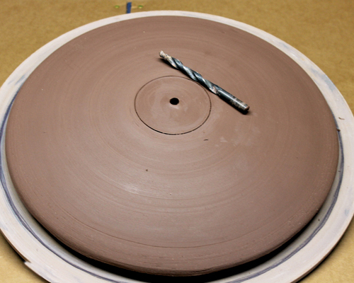 10 After smoothing the form, drill a hole for the clock stem using a ⅜-inch drill bit. 