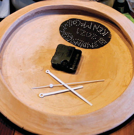 16 Assemble the clock parts, including the hands and the battery-powered motor.