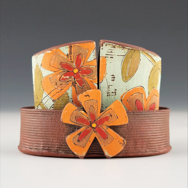 2 Salt-and-pepper shakers, 4½ in. (11 cm) in length, red stoneware, underglaze, colored slip, glaze, fired to cone 6 in oxidation, 2022. Photos: Eric Botbyl.