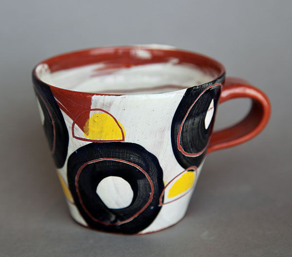 3 Nikki Lewis’ Untitled: Circle Cups, 4½ in. (11 cm) in diameter, red earthenware, underglaze, slips.