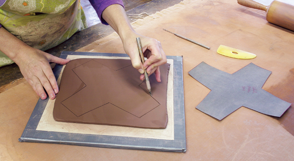 2 Trace the pattern and cut along the valley created by the needle tool with an X-Acto knife.