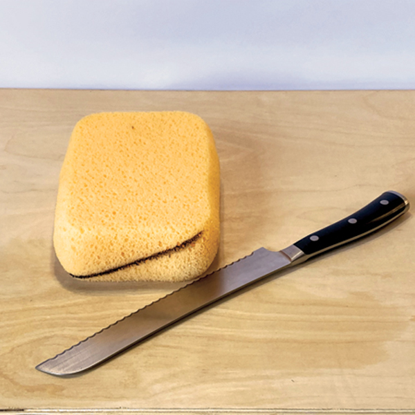 3 For bigger handles, cut a large sponge diagonally using a serrated knife.