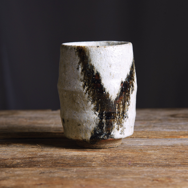 1 White and black cup, 4 in. (10 cm) in height, wild stoneware, quartz-sand and wood-ash glaze, iron design, reduction fired to cone 10, 2020. 