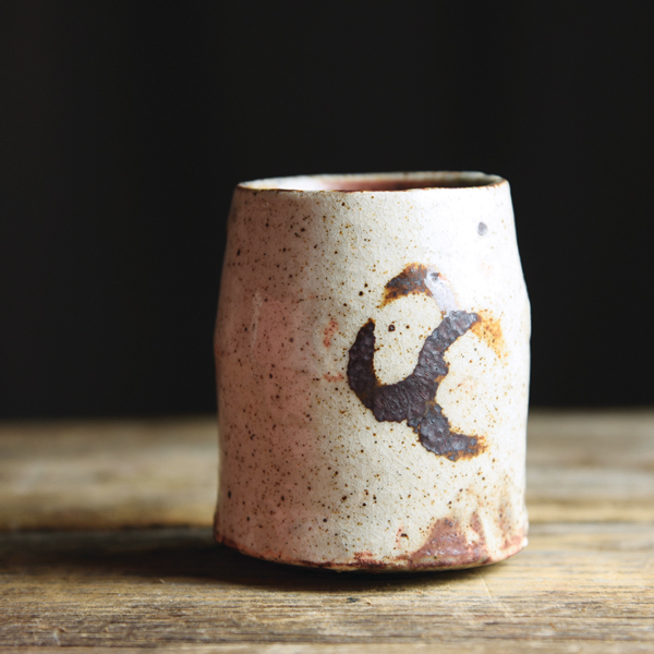 8 Iron-brushed teacup, 4 in. (10 cm) in height, local dark stoneware with kaolin slip, feldspar/ash glaze, and ilmenite decoration, 2021. 