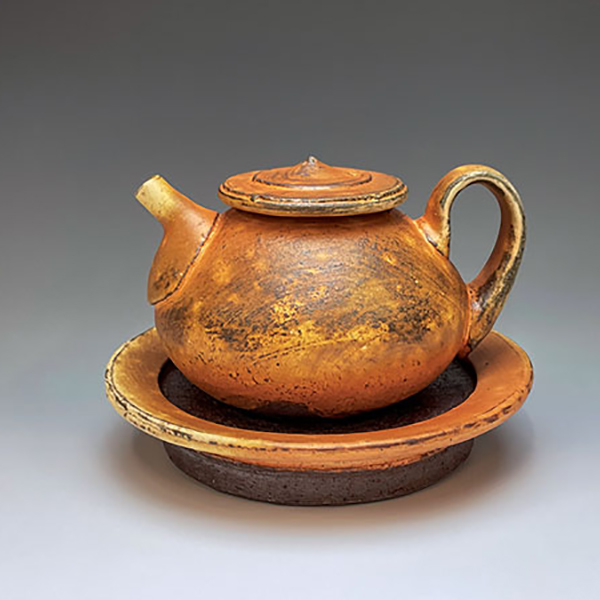 6 Quinn Maher’s teapot and tray, 5½ in. (14 cm) in width, earthenware, soda fired to cone 3.