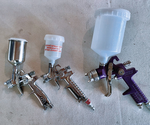 2 Three different inexpensive spray guns. 