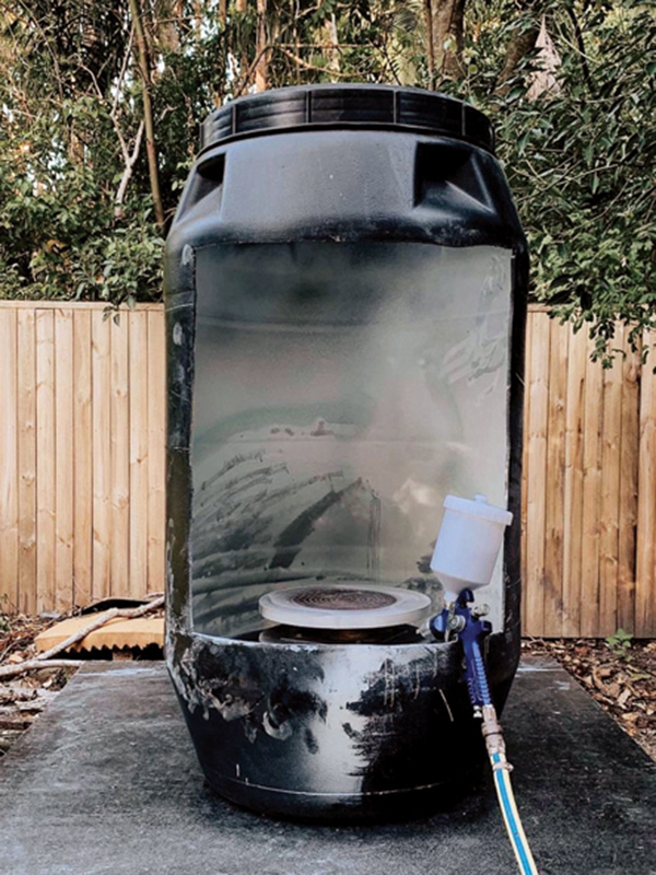 5 Cut one side from a plastic storage drum to make a compact spray booth. Photo: @grit_ceramics.* 