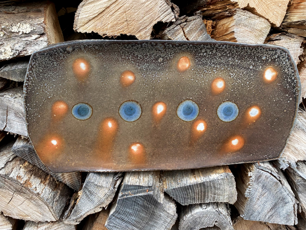 5 Mark Hewitt’s rectangular platter, 17 in. (43 cm) in length, high-alumina slip, wad marks, blue glass accents, wood-fired salt glaze, 2021.