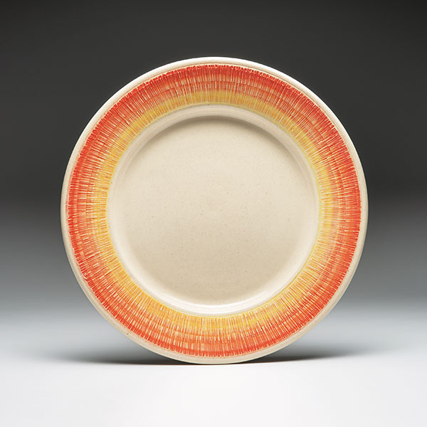 2 Sun Platter, 12 in. (30 cm) in diameter, mold-thrown ceramic, altered with roulette decoration, underglaze, fired to cone 6 in oxidation. 