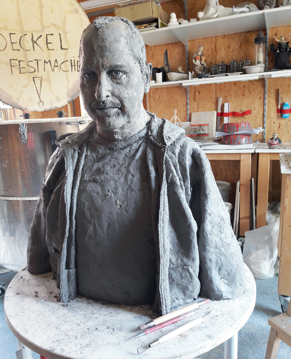 D Here you can see the face has changed after the engobe layering.