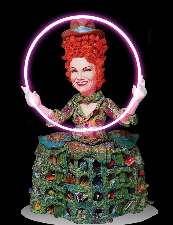 Above: A snapshot of Tony Natsoulas’ portrait of the singer/songwriter, activist, and philanthropist Annie Lennox, which he completed just before this issue went to press. Natsoulas explains that the circle of neon represents the organization that Lennox founded, The Circle, which helps further women’s rights around the world. The objects in her dress help to convey information about her life.