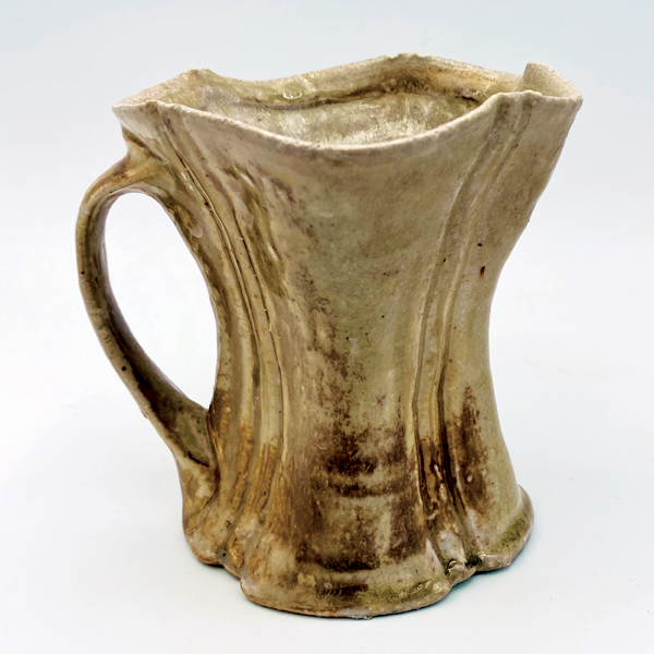 12 Eric Ordway’s mug, white stoneware, yellow flashing slip, wood fired to cone 10 with gas reduction, 2022.
