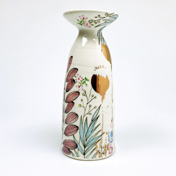 6 Justin Rothshank and Yesha Panchal’s vase, 10 in. (25 cm) in height, wheel-thrown porcelain, slip-trailed, glaze, decals, 2021. 
