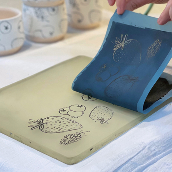 3 Gently peel away the silkscreen to reveal the image remaining on the Gelli plate. 