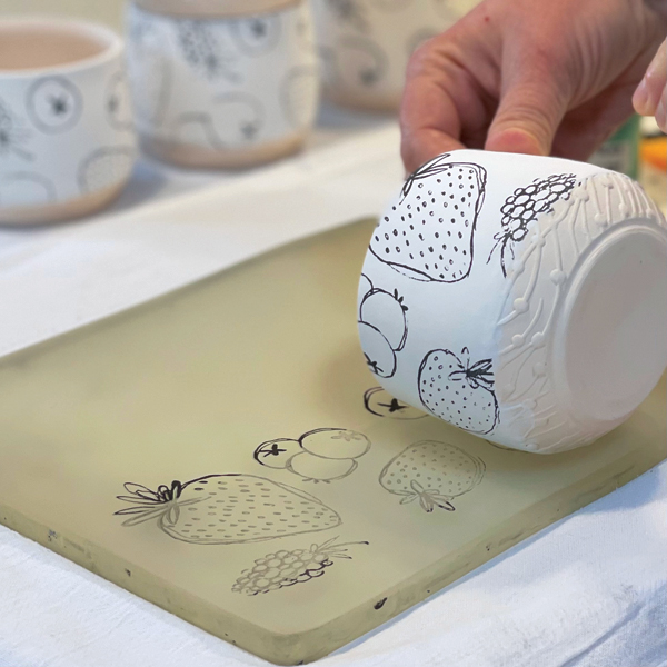 4 Using gentle pressure, roll the pot over the print. 