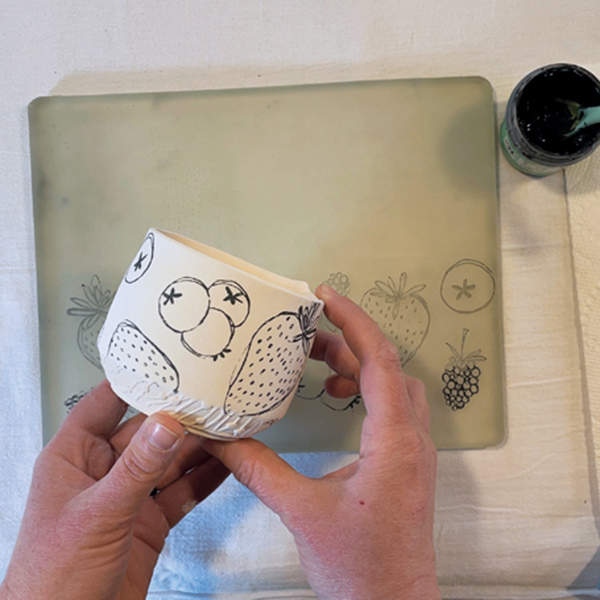 6 The image transfers from the Gelli plate to the pot and is ready for further decoration.
