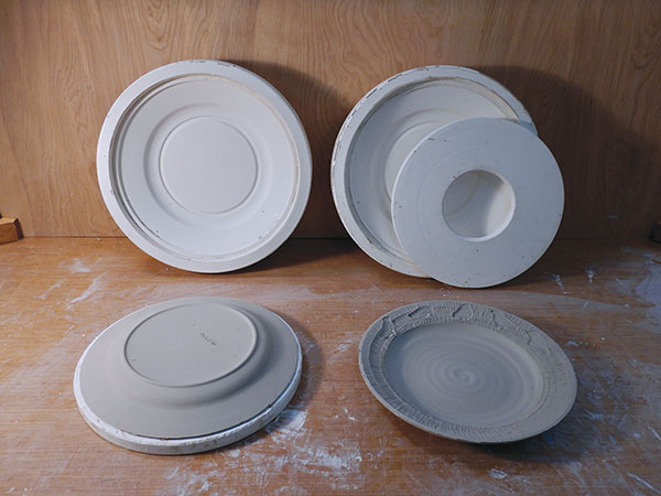 23 Demolding the plates directly onto plaster bats that fit inside of the molds. 