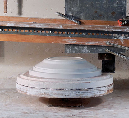 14 Setup with a template for turning the outside of the mold, which will be poured over the model.