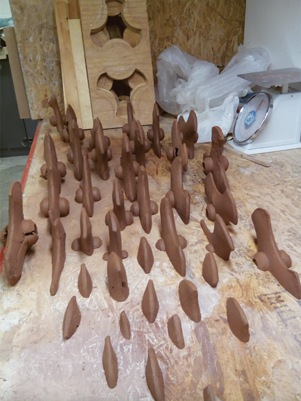 2 Small-scale models of the whole and segmented tiller form set up to plan the installation. 