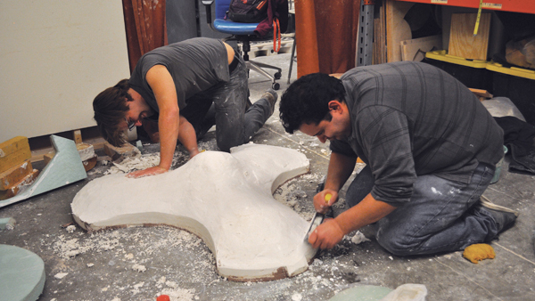 6 After the forms are cast, the plaster mold is refined to remove excess weight and round the edges so they don’t chip while the mold is in use.