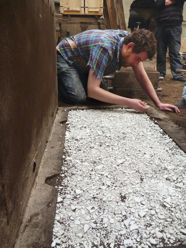 4 Setting up to pour aluminum over porcelain shards at the aluminum factory in Beijing, China.