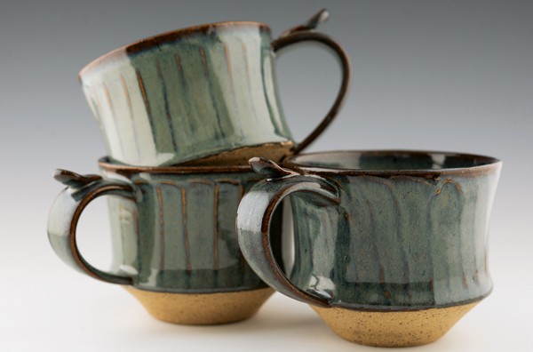 6 Variegated-blue mugs, 4 in. (10 cm) in length, stoneware, glaze, fired to cone 6.