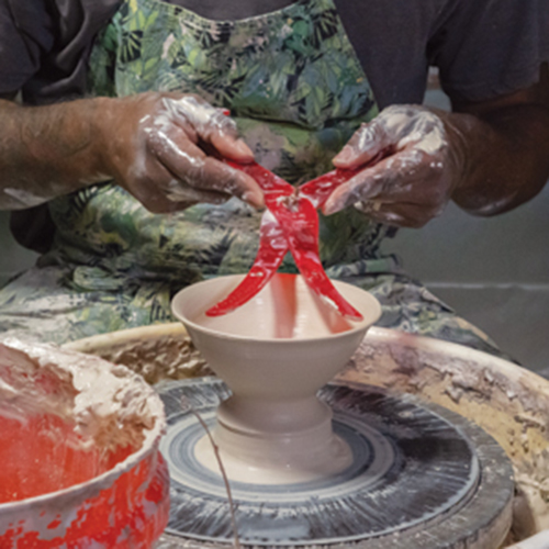8 Brown throwing a gaiwan off the hump, then using calipers to measure for the gaiwan’s lid. Photo: photophobic images.