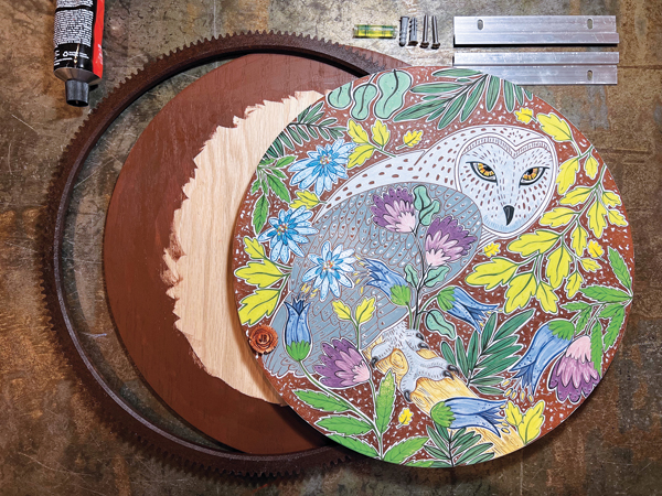 14 Mount the clean, sealed frame to a prepared wood backing, then mount the fired tile and add a French cleat to the back with epoxy.