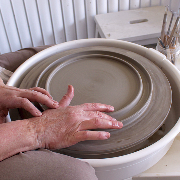 4 Throw the game board on the wheel head with an outer and inner ridge.