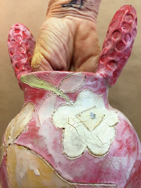 8 When the wax is no longer sticky, gently push and stretch the pot until the thick wax cracks.