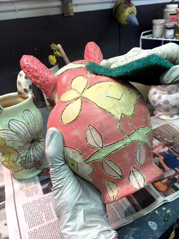 11 Allow the vase to dry overnight, then wipe off the wash with a damp sponge and a scouring pad to soften the burrs.