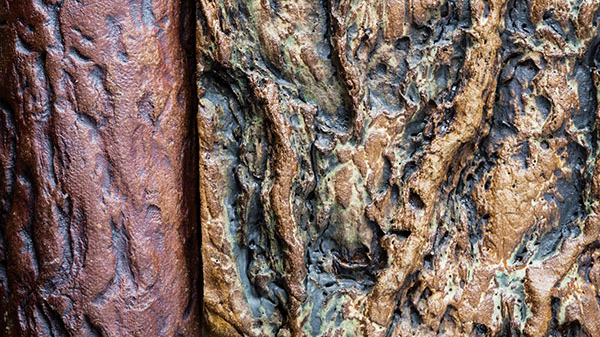 2 Oxide patina on bark-textured surface.