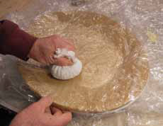 8 Cover the slab with another dry cleaning bag and use a ballast bag to form the slab to the platter mold.