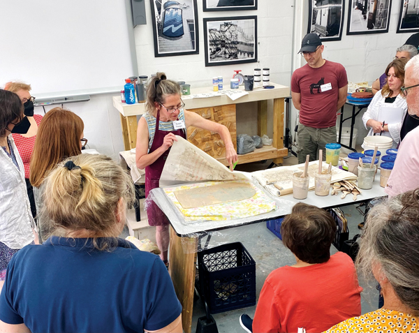 3 Presenter Susan Feagin demonstrating her technique for image transfer and printing on slabs.