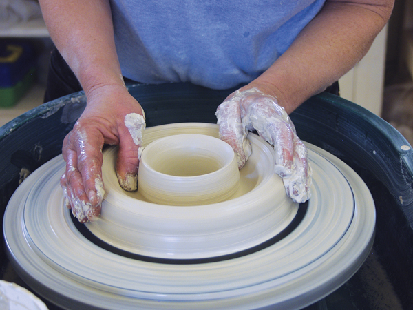 2 Open up a channel in the doughnut, leaving only ¼ inch of clay on the bottom since you won’t be trimming a foot.