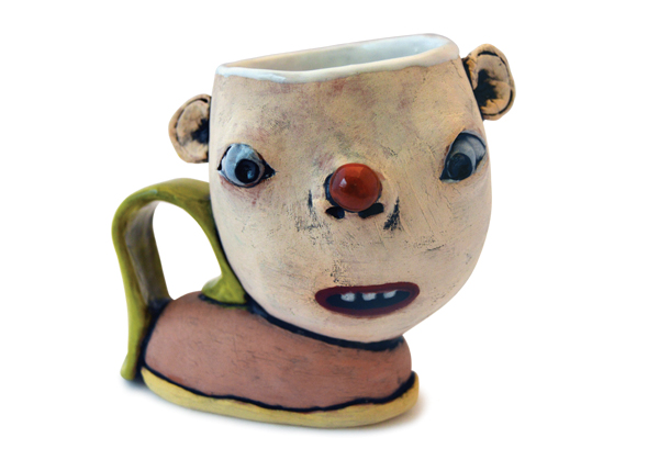 1 Tammy Marinuzzi’s coffee mug, 6 in. (15 cm) in width, slab-built terra cotta, colored slips, glaze, fired to cone 03 in an electric kiln, 2021. 