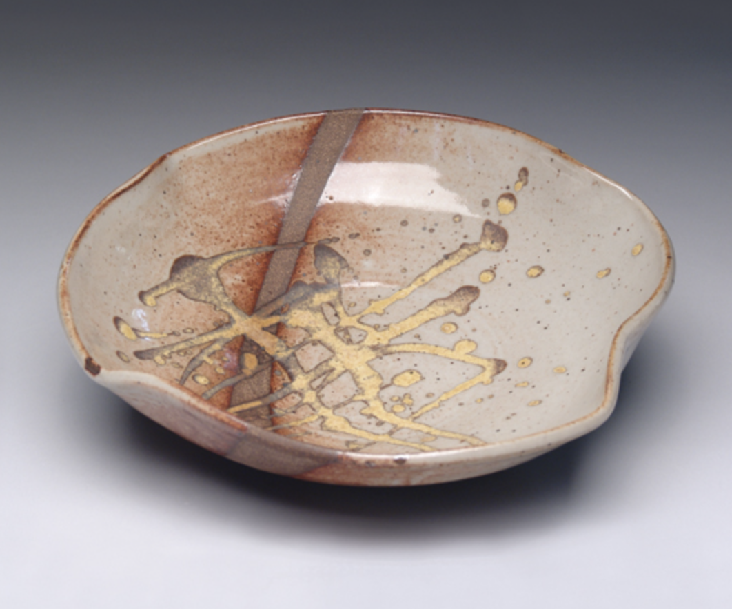 Thrown and altered platter, 12 in. (30 cm) in diameter, stoneware with Cherry Blossom Shino and Woo Yellow glaze, fired in reduction to cone 6, by Barbara Morgenbesser.