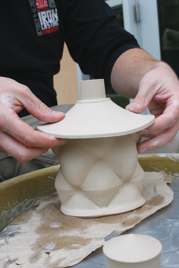 9 After the top portion dries to a soft leather hard, shape it to better fit the oval form of the flask.