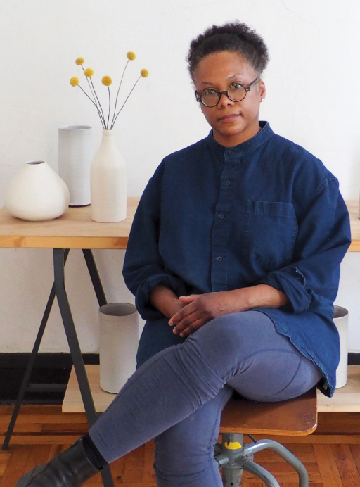 3 Tracie Hervy with a few of her pieces.