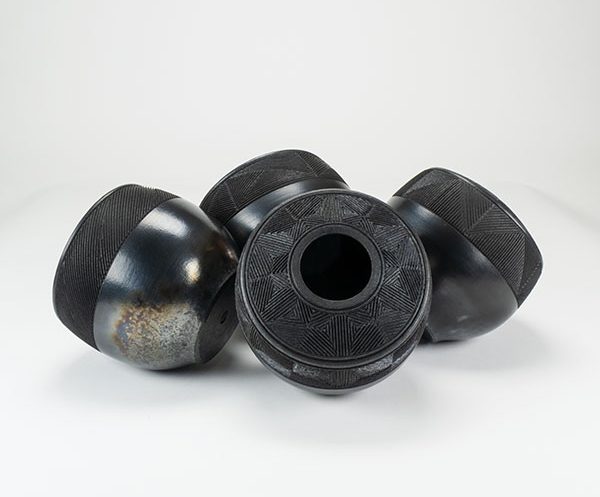7 Vase cluster, to 8 in. (20 cm) in height, stoneware, terra sigillata, raku fired.