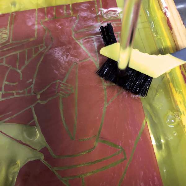 7 Run water over the screen to remove the drawing fluid.