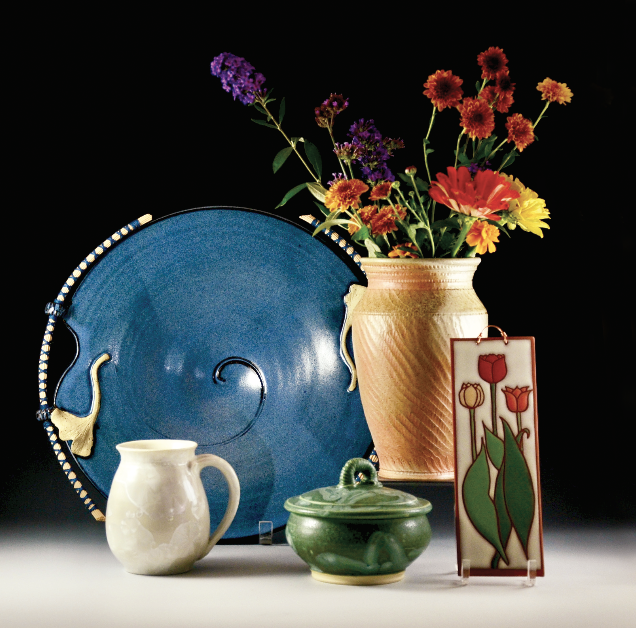 9 Back row, left to right: Jane Hockensmith-Reich’s platter, stoneware, reed handles; Brad Husk’s vase, wood-fired stoneware. Front row, left to right: Jerry Davis’ mug, porcelain, crystalline glaze; Janet Murie’s stoneware covered jar; Kate Lally’s earthenware tulip tile. 