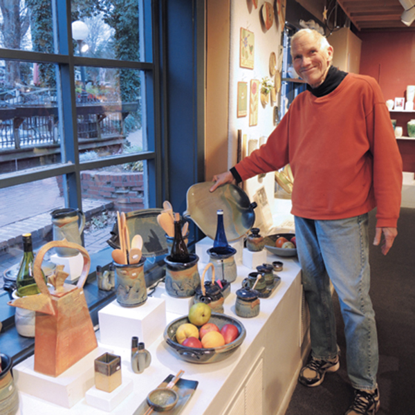 7 David Hergesheimer holds one of his wife, Keiko’s platters. 